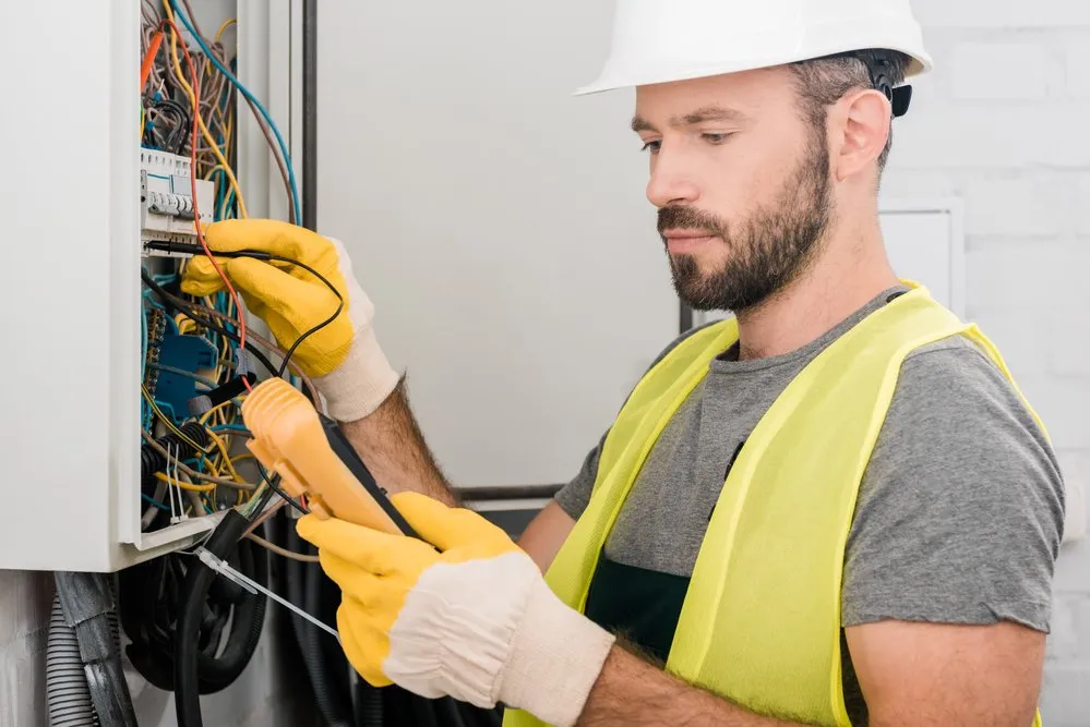 Durston Electrical — licensed electrician working on a switchboard in Newcastle NSW